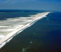 aerial photo of a coastal beach and water